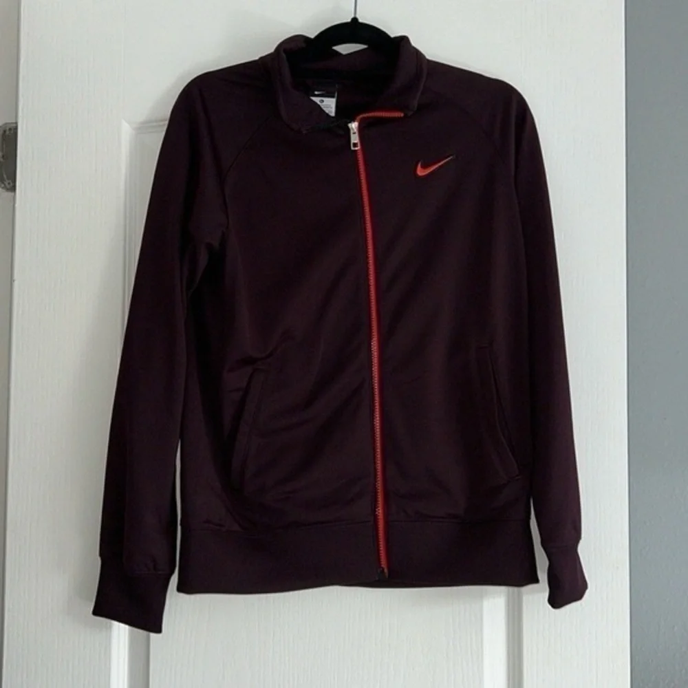 Maroon Nike Jacket size XL Youth black and orange detailing fits womens M/L